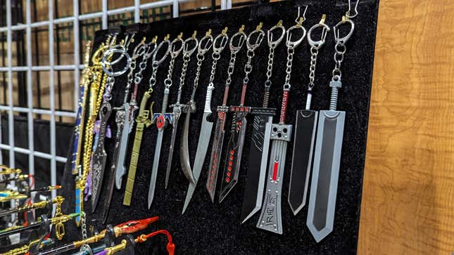 Swords from various franchises sit on display as keychains.