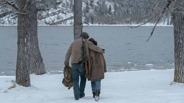 Joel (Pedro Pascal) and Ellie (Bella Ramsey) walk together next to a lake in The Last of Us