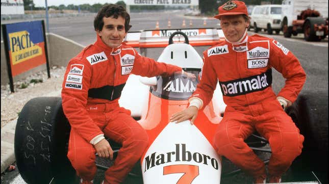 Alain Prost (left) and Niki Lauda (right) pose with the McLaren they’d be driving for 1984.