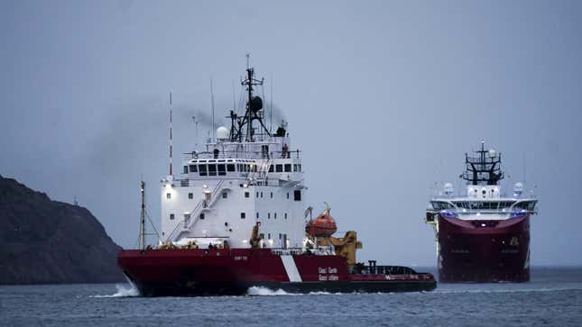 A photo of two research ships out at sea. 