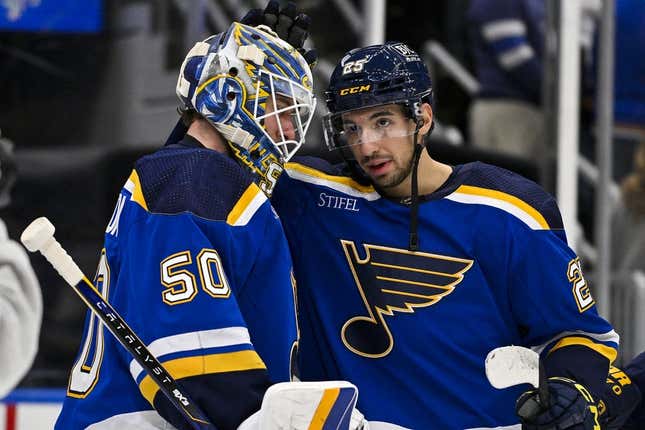 Jan 11, 2024; St. Louis, Missouri, USA;  St. Louis Blues center Jordan Kyrou (25) and goaltender Jordan Binnington (50) celebrate after the Blues defeated the New York Rangers at Enterprise Center.