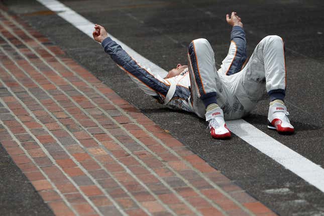 Dan Wheldon of England, driver of the #98 William Rast-Curb/Big Machine Dallara Honda, celebrates at the start/finish line after winning the IZOD IndyCar Series Indianapolis 500 Mile Race at Indianapolis Motor Speedway on May 29, 2011 in Indianapolis, Indiana