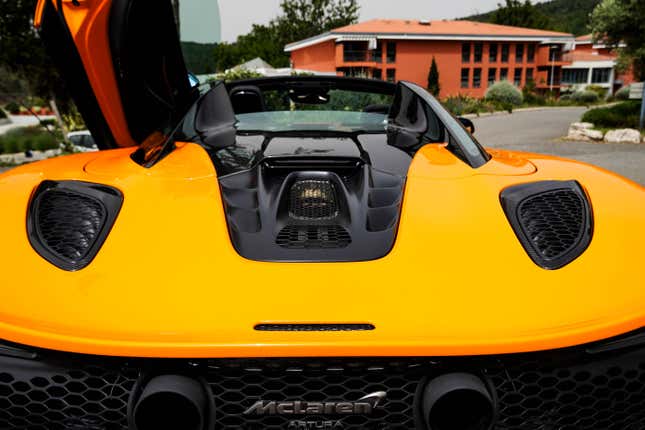 Engine cover of an orange McLaren Artura Spider