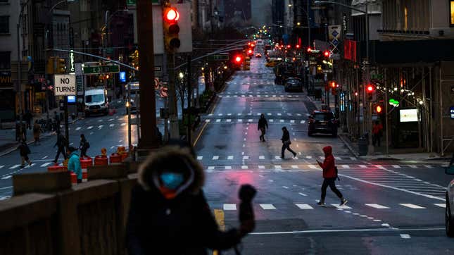 People cross Park Av. after it was announced that some streets will be shut as lockdown continues in response to the coronavirus (COVID-19) outbreak on March 27, 2020 in New York City. Mayor Bill de Blasio chose four streets across four boroughs to test whether shutting down streets to vehicular traffic would increase social distancing among pedestrians during the COVID-19 pandemic shutdown. 