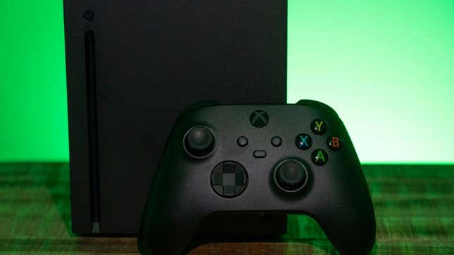 An Xbox Series X on a green background with the default Xbox controller front and center.