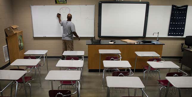 Gardendale High School biotech teacher Justin Ingram readies his classroom before school begins next week in Gardendale, AL, on August 4, 2016. 