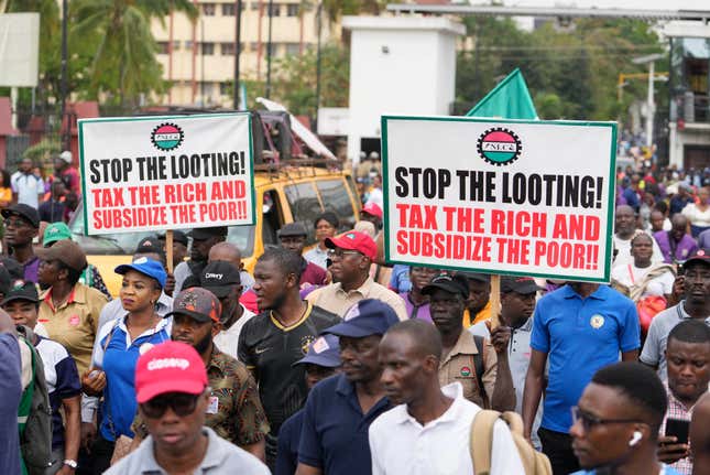 Labour unionist march on the streets to protest economic hardship in Lagos Nigeria, Tuesday, Feb. 27, 2024. Nigerian Labour Union workers began a new nationwide protest Tuesday, that threatens to shut down key services across the country. Protestors are angry at the growing economic hardship with talks late Monday night breaking down to avert the walkout. (AP PhotoSunday/Alamba)