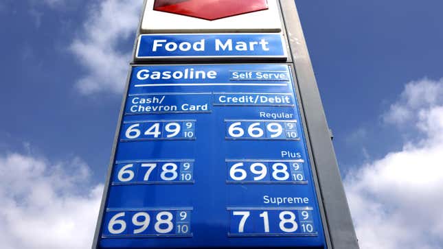 A photo of high gas prices displayed on a Chevron sign showing the 9/10 fraction