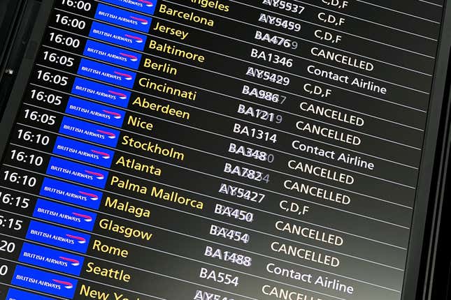 Passengers look at the departures board at Heathrow Airport, in London, Monday, Aug. 28, 2023. Britain’s air traffic control system says it is experiencing a “technical issue” that could delay flights on Monday, the end of a holiday weekend and a busy day for air travel. (AP Photo/Alberto Pezzali)