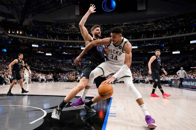 DALLAS, TEXAS - FEBRUARY 03: Giannis Antetokounmpo #34 of the Milwaukee Bucks is defended by Maxi Kleber #42 of the Dallas Mavericks during the second half at American Airlines Center on February 03, 2024 in Dallas, Texas. NOTE TO USER: User expressly acknowledges and agrees that, by downloading and or using this photograph, User is consenting to the terms and conditions of the Getty Images License Agreement. (Photo by Sam Hodde/Getty Images)