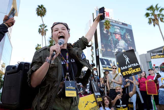 SAG-AFTRA captain Mary M. Flynn rallies fellow striking actors on a picket line outside Netflix studios, Wednesday, Nov. 8, 2023, in Los Angeles. (AP Photo/Chris Pizzello)