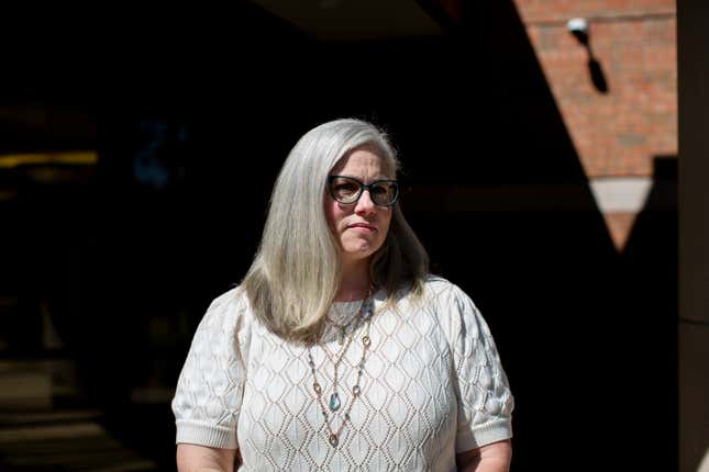 FILE - Adeline Hambley, Ottawa County, Mich., health officer, poses for a portrait outside of the county administration building, Tuesday, Sept. 5, 2023, in West Olive, Mich. The top health official in one of Michigan’s largest counties is asking a judge to uphold a $4 million settlement in exchange for Hambley&#39;s resignation, coming after months of conflict with local conservative leaders who were elected in response to COVID-19 restrictions.(AP Photo/Kristen Norman, File)