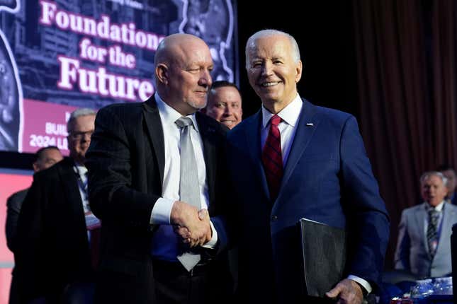 President Joe Biden talks with NABTU President Sean McGarvey after speaking to the North America&#39;s Building Trade Union National Legislative Conference, Wednesday, April 24, 2024, in Washington. (AP Photo/Evan Vucci)