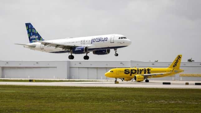 JetBlue and Spirit airplanes at Fort Lauderdale-Hollywood International Airport (FLL) in Fort Lauderdale, Florida, US, on Saturday, May 21, 2022.