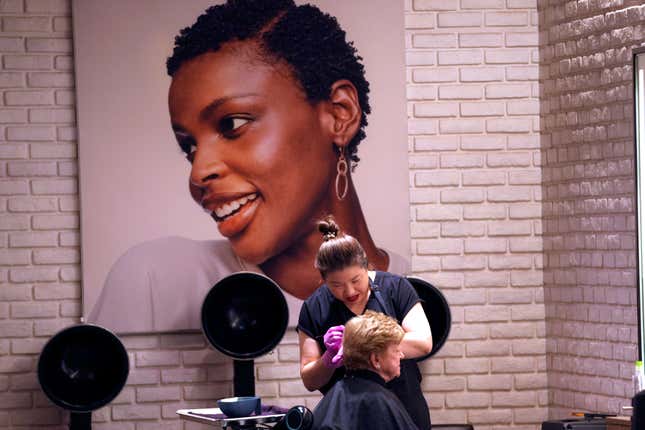 A customer receives a hair coloring at a JCPenney store beauty salon in Frisco, Texas, Wednesday, Aug. 30, 2023. JCPenney is reinvesting more than $1 billion into the storied but troubled 121-year-old department store business by the end of 2025 to remodel its stores, upgrade its online shopping site and app and make its supply network more efficient to speed up online shipping among other plans. (AP Photo/LM Otero)