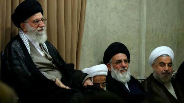 Khamenei, left, with Rouhani, far right.