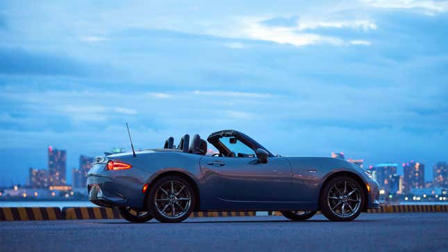 A photo of a grey Mazda Miata sports car. 