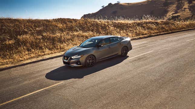 A grey Nissan sedan 