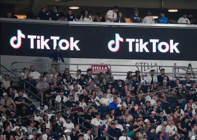 FILE - Fans sit under a TikTok ad at a baseball game at Yankee Stadium, April 14, 2023, in New York. President Joe Biden&#39;s campaign is embracing TikTok to court younger voters ahead of the U.S. presidential elections, but U.S. adults seem to be split about whether the video-sharing app should even operate in the country. (AP Photo/Frank Franklin II, File)