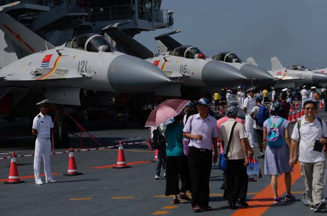 Visitors walk on China's first aircraft carrier Liaoning during an open day at a naval base in Hong Kong, China, July 9, 2017. Picture taken July 9, 2017.
