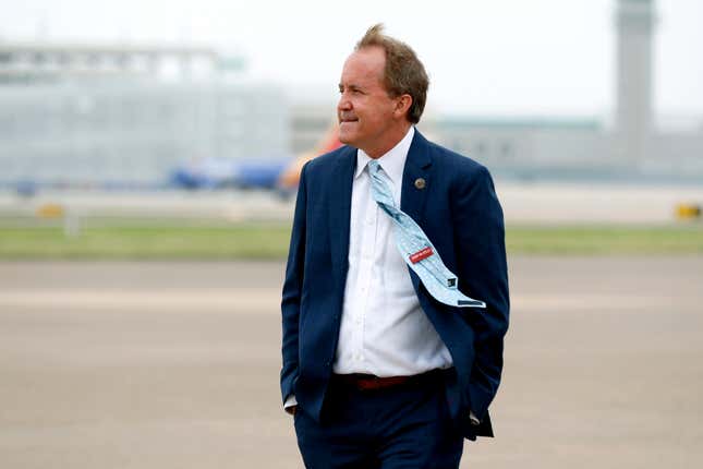 In this June 28, 2020 file photo, Texas’ Attorney General Ken Paxton waits on the flight line for the arrival of Vice President Mike Pence at Love Field in Dallas. A longshot lawsuit that President Donald Trump called “the big one” in his effort to subvert the will of the voters was helmed by Republican Texas Attorney General Ken Paxton, who is likewise trying to reverse his own skidding fortunes.