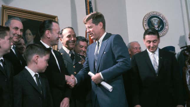 President John F. Kennedy shakes hands and meets officials involved in the X-15 rocket plane project at the awarding of the Harmon International Trophy to NASA in the White House.