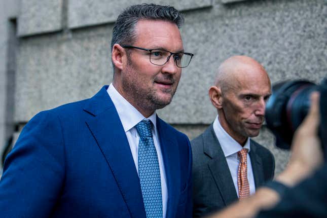 FILE - Trevor Milton, left, leaves the Thurgood Marshall United States Courthouse, Sept. 12, 2022, in New York. Milton was sentenced Monday, Dec. 18, 2023, to four years in prison for his conviction for exaggerating claims about his company&#39;s production of zero-emission 18-wheel trucks, causing investors to lose hundreds of thousands of dollars. (AP Photo/Brittainy Newman, File)