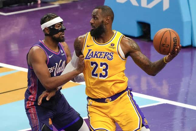 Nov 10, 2023; Phoenix, Arizona, USA; Los Angeles Lakers forward LeBron James (23) drives against Phoenix Suns guard Jordan Goodwin (0) in the first half at Footprint Center.