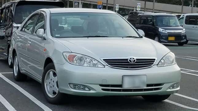 A silver Toyota Camry, similar to the one that broke thorough the fence