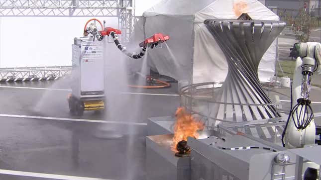 A photo of the Dragon Firefighter robot heading towards a fire to extinguish it