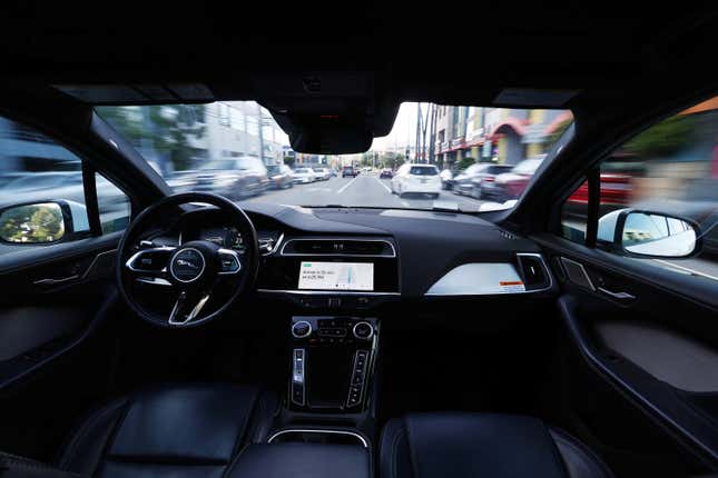 A Waymo robotaxi operates without a driver in Los Angeles, CA.