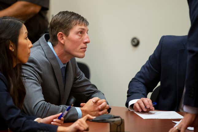 Ex-Grand Rapids police officer Christopher Schurr listens as Judge Nicholas Ayoub binds the case for trial at the Kent County Courthouse in Grand Rapids, Mich., on Monday, Oct. 31, 2022. Schurr will face trial for second-degree murder in the fatal shooting Black motorist Patrick Lyoya in the back of the head on April 4.