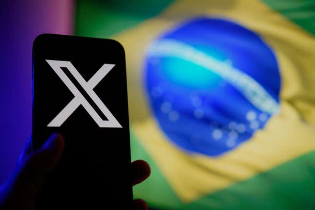 X app in front of Brazil flag