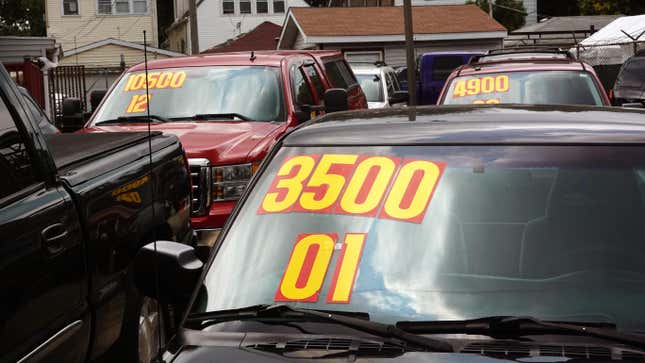 Used cars are offered for sale at a dealership on July 11, 2023 in Chicago, Illinois. 