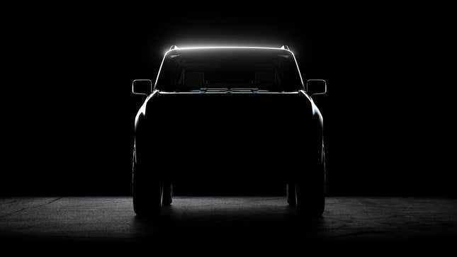 Teaser image of the front end of a Scout EV in darkness