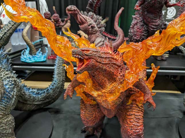 A statue of Godzilla on fire is on display.