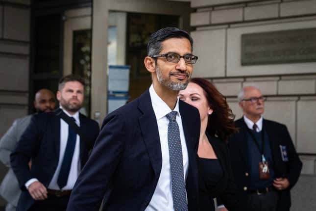 Sundar Pichai walking in front of federal court, people are behind him