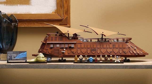 A guy plays with the Lego barge