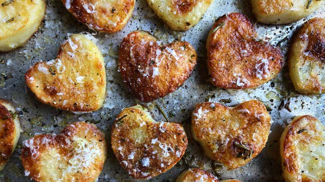 Heart-shaped Garlic-Parmesan Roasted Potatoes on sheet pan