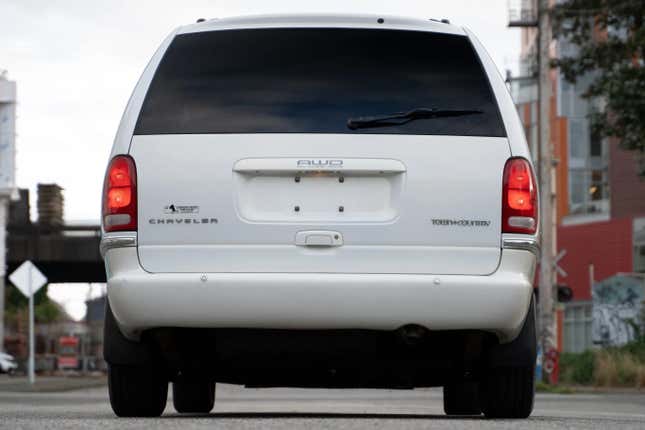 a rear shot of a white chrysler town and country awd