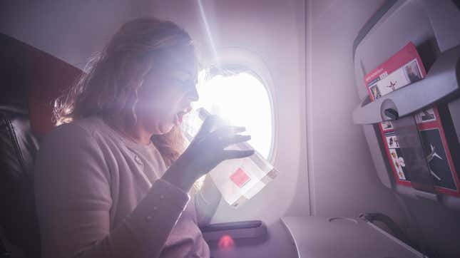 Sick woman with nausea in the airplane.