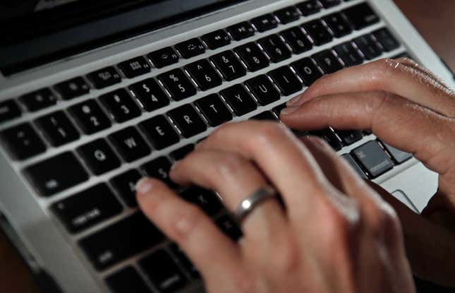 FILE - A person works on a laptop in North Andover, Mass., on June 19, 2017. Cyberattacks on businesses are rising, including small businesses. It’s a troubling trend that can be very costly and time consuming if owners don’t have a plan to deal with them. (AP Photo/Elise Amendola, File)