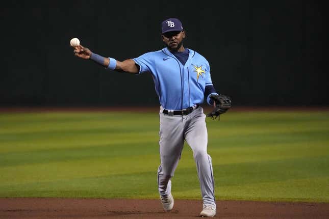 Jun 28, 2023; Phoenix, Arizona, USA; Tampa Bay Rays second baseman Vidal Brujan (7) throws to first base against the Arizona Diamondbacks during the seventh inning at Chase Field.