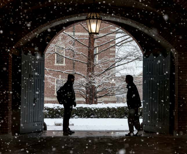 FILE - Wheaton College students stop to chat on the Norton, Mass. campus, Feb. 13, 2024 as snow falls. More than 75 million student loan borrowers have enrolled in the U.S. government&#39;s newest repayment plan since it launched in August. (Mark Stockwell/The Sun Chronicle via AP, File)