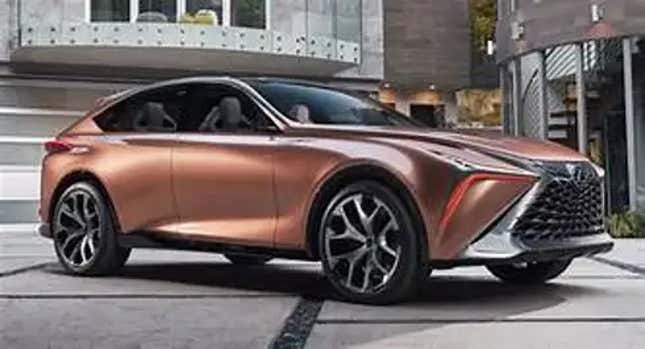 A copper Lexus SUV is parked in front of buildings.