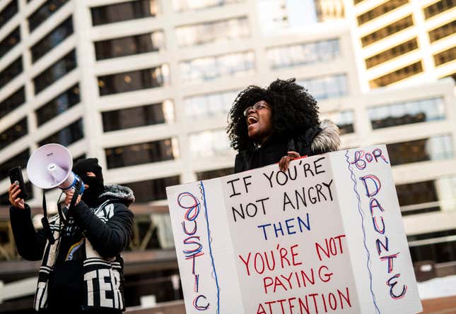 MINNEAPOLIS, MN - DECEMBER 23: People demonstrate in support of the family of Daunte Wright outside the Hennepin County Government Center on December 23, 2021 in Minneapolis, Minnesota.