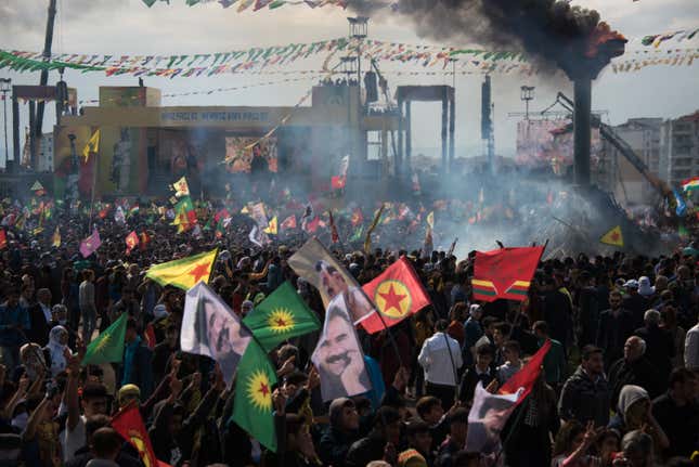 Groups of teenagers encircled the crowd, chanting political slogans and waving flags with the face of Abdullah Ocalan.