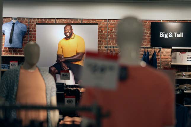 File - A photograph a former basketball star Shaquille O&#39;Neal hangs in the big and tall section at a JCPenney store in Frisco, Texas, on Aug. 30, 2023. On Thursday, the Labor Department issues its report on inflation at the consumer level. (AP Photo/LM Otero)