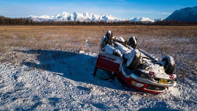 A car sits overturned along a highway after a snow storm on November 04, 2022 in Wasilla, Alaska.