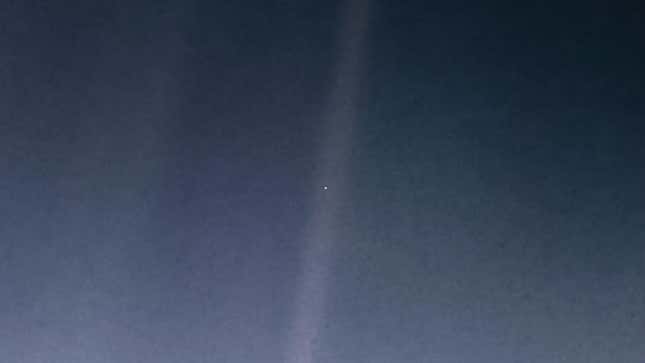 The “Pale Blue Dot” image taken by Voyager 1 spacecraft in 1990, showing Earth as a tiny bright speck surrounded by darkness.